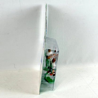 Two small figurines in a clear plastic display case on a white background