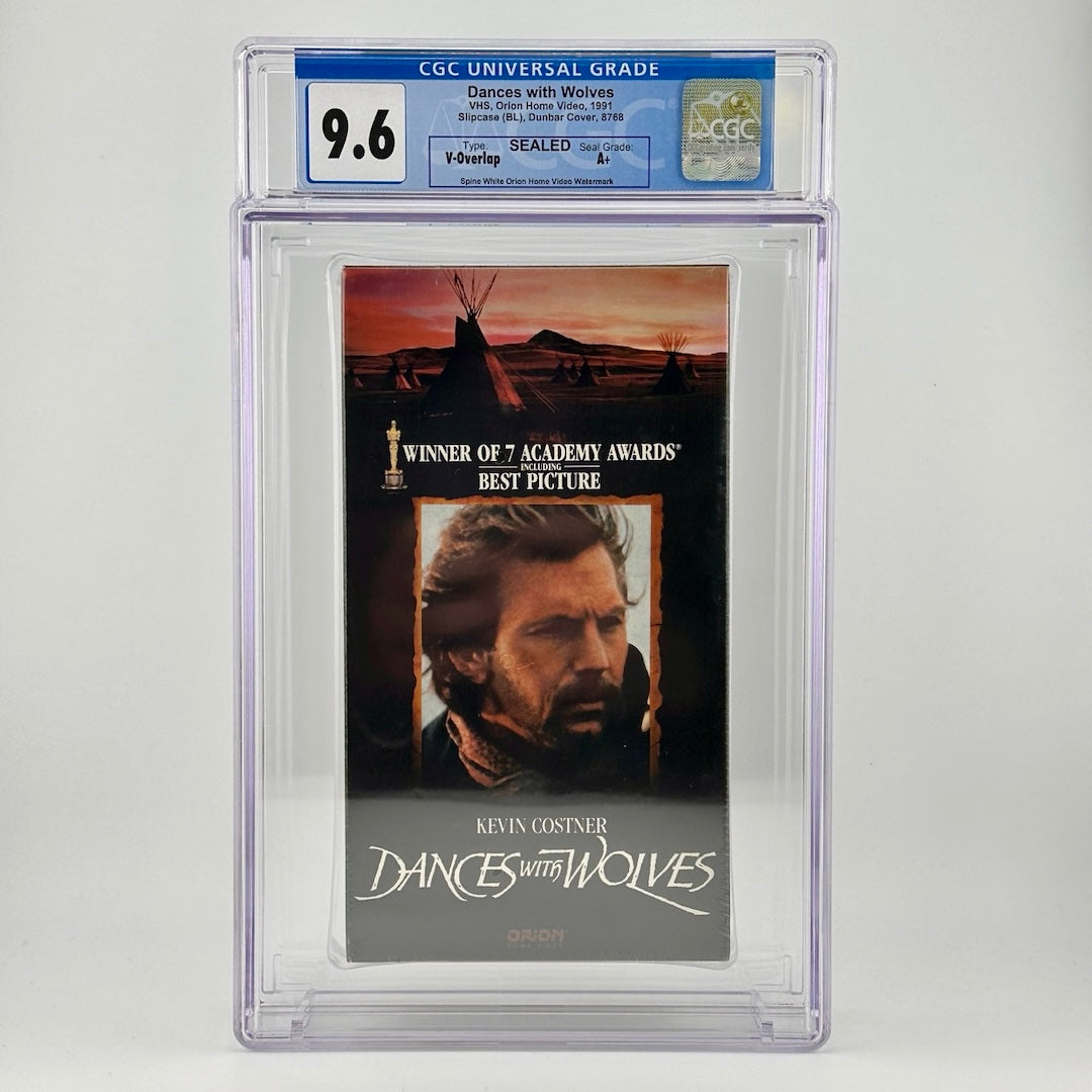 Acrylic case with vhs inside. Vhs has Kevin Costner's face below native teepees. grade value above with details in blue.  