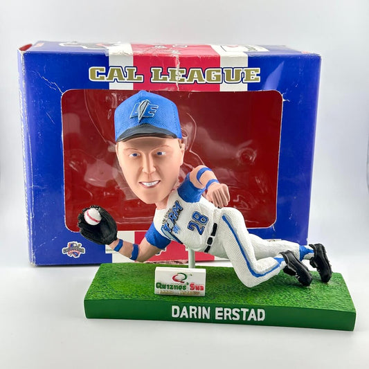Baseball player figurine with packaging labeled 'Cal League' on a white background