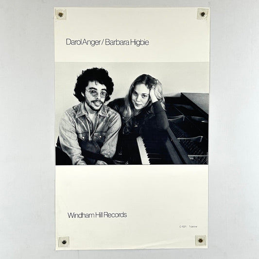 Poster of two people sitting at a piano with 'Windham Hill Records' branding.