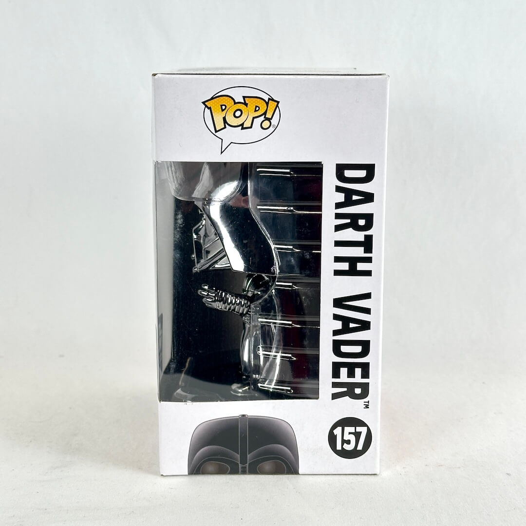 Funko Pop! Darth Vader collectible figure in its original white window box packaging.