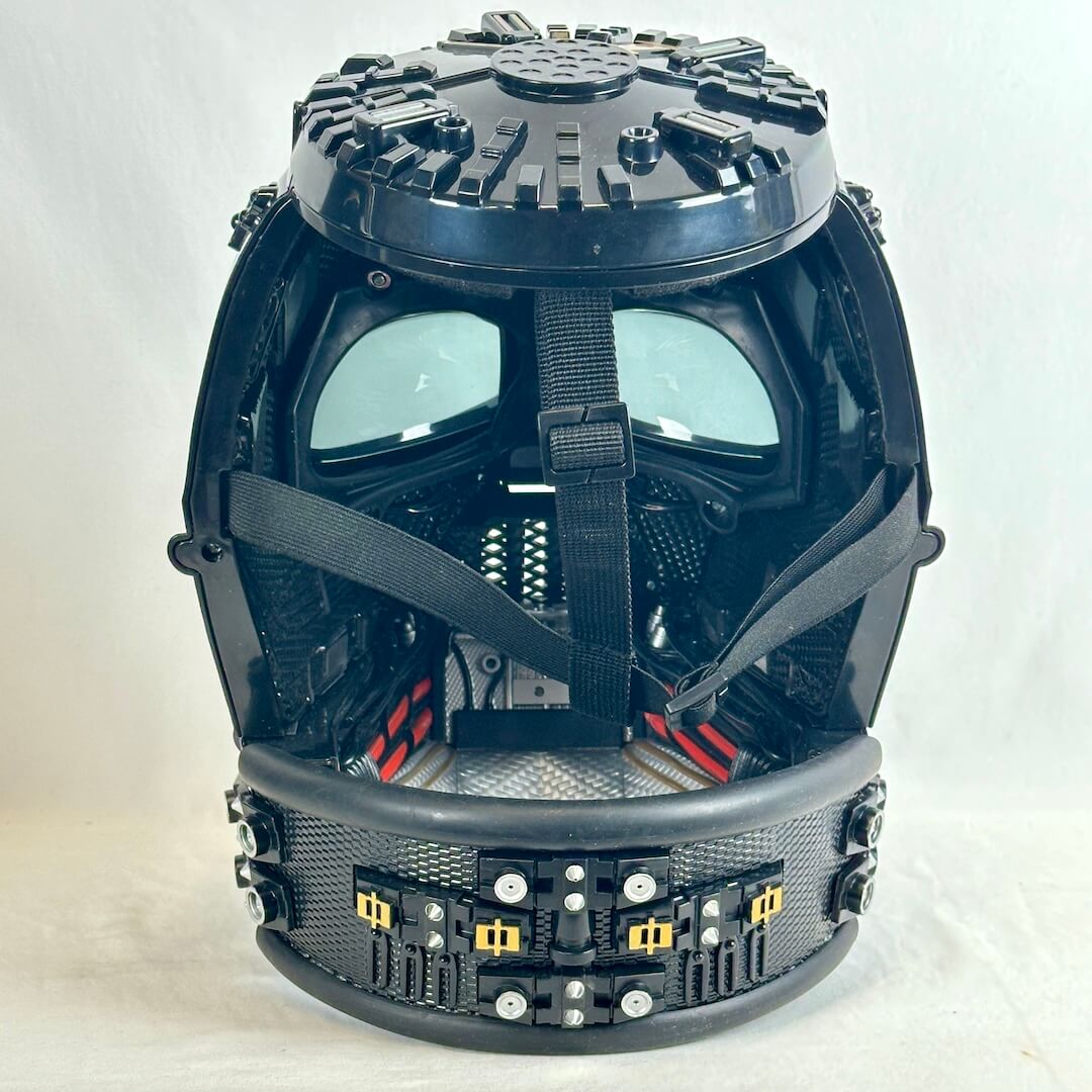 Back view of helmet without top piece showing interior of mask and all the intricate details. 