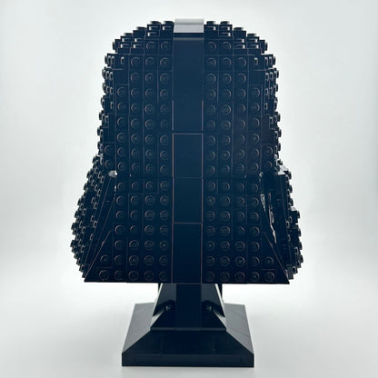 Darth Vader Lego helmet with stand against white background. 