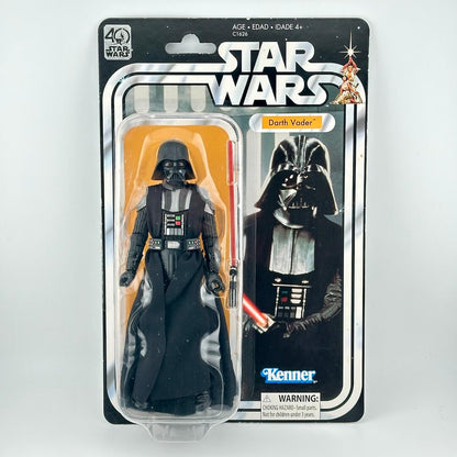 Star Wars action figure in its original blister packaging with retro-style card back; figure in all black with helmet. 