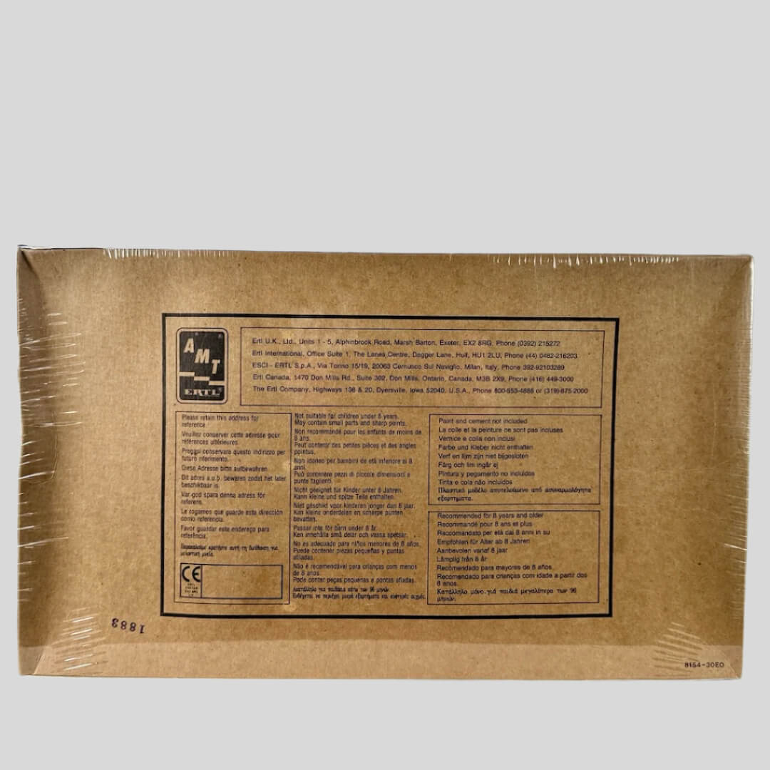 Back of plastic wrapped box with manufacturer & copyright info in black text at center.