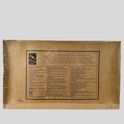 Back of plastic wrapped box with manufacturer & copyright info in black text at center.