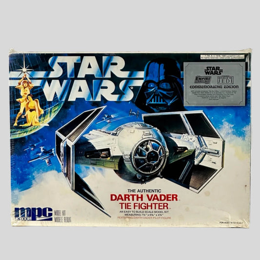 Darth Vader's TIE Fighter in flying scene depicted on box under STAR WARS logo & Vader's face by item sticker.