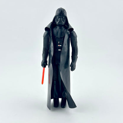A Darth Vader action figure wearing a long black cloak and holding a red lightsaber.