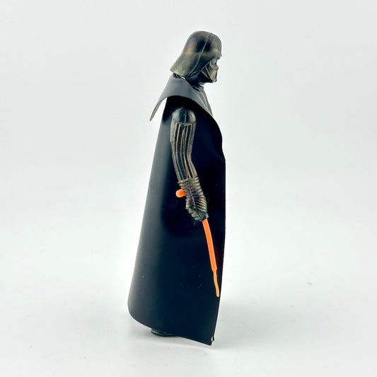 Black and gray figure with a glowing orange blade on a white background