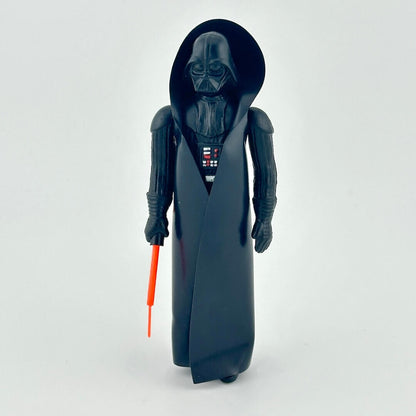 Toy figure of a character in a black robe with a red lightsaber on a white background