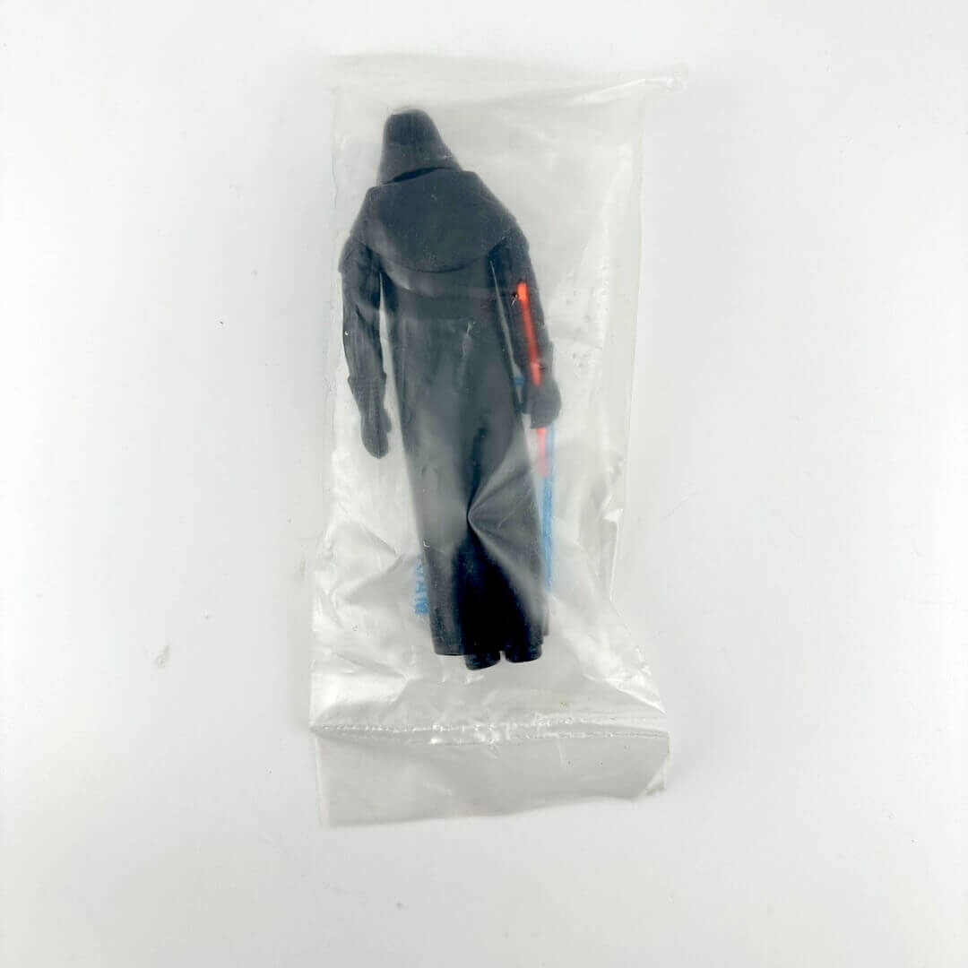 Darth Vader action figure in clear plastic bag with "Kenner" branding printed on bag, against white background.