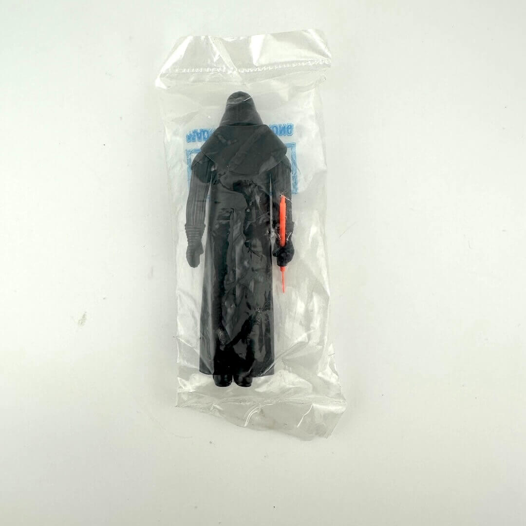 Darth Vader action figure in clear plastic bag with "Kenner" branding printed on bag, against white background.