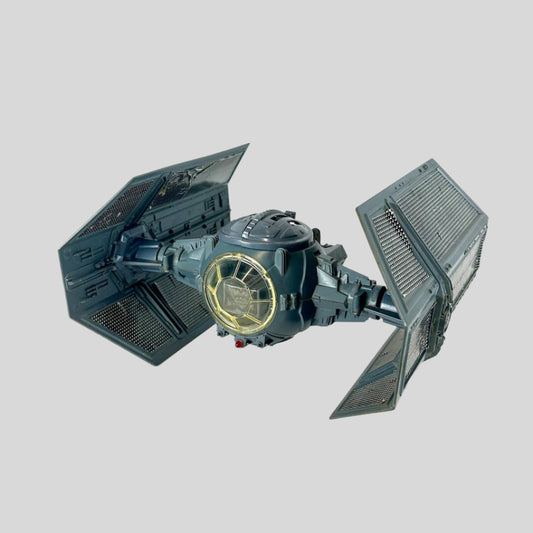 Model of a TIE fighter from Star Wars on a white background