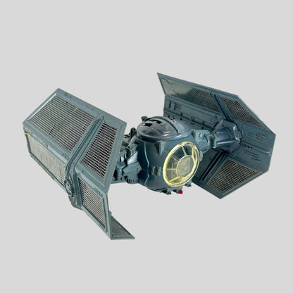Model of a TIE fighter from Star Wars on a white background