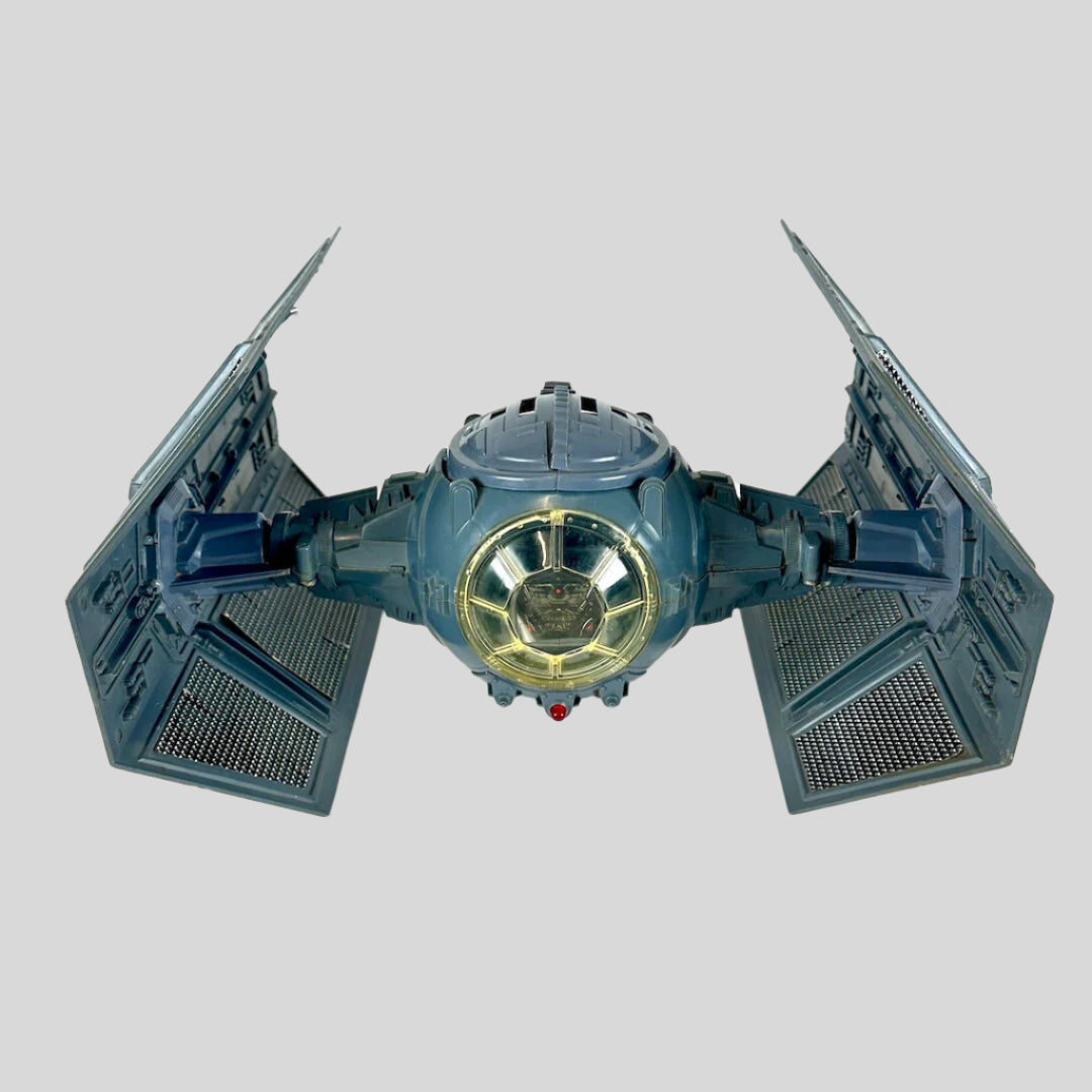 Model of a TIE fighter from Star Wars on a white background