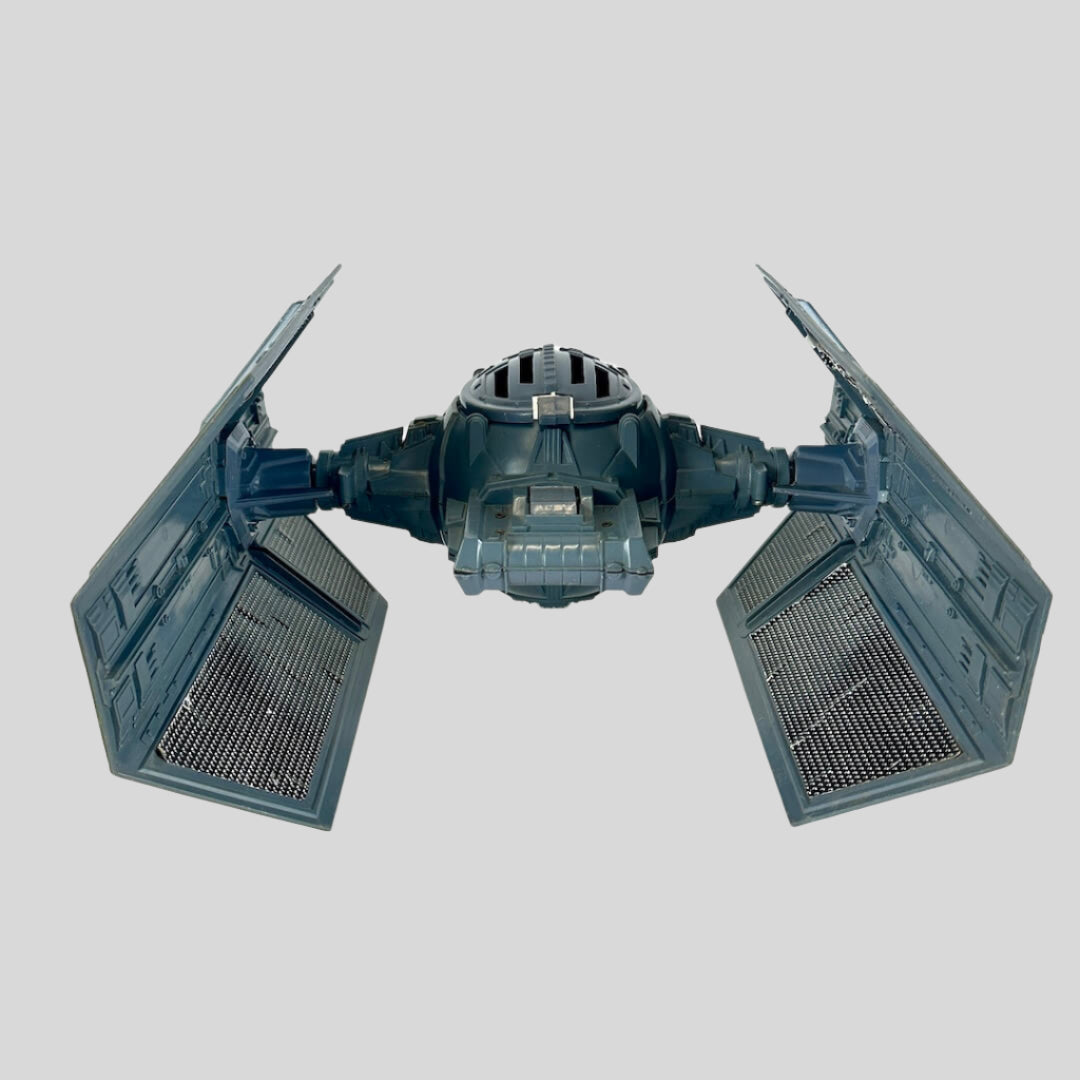 Toy model of a TIE fighter on a white background