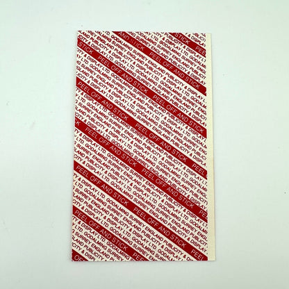 Backside of event pass showing intact backing and pristine condition. 