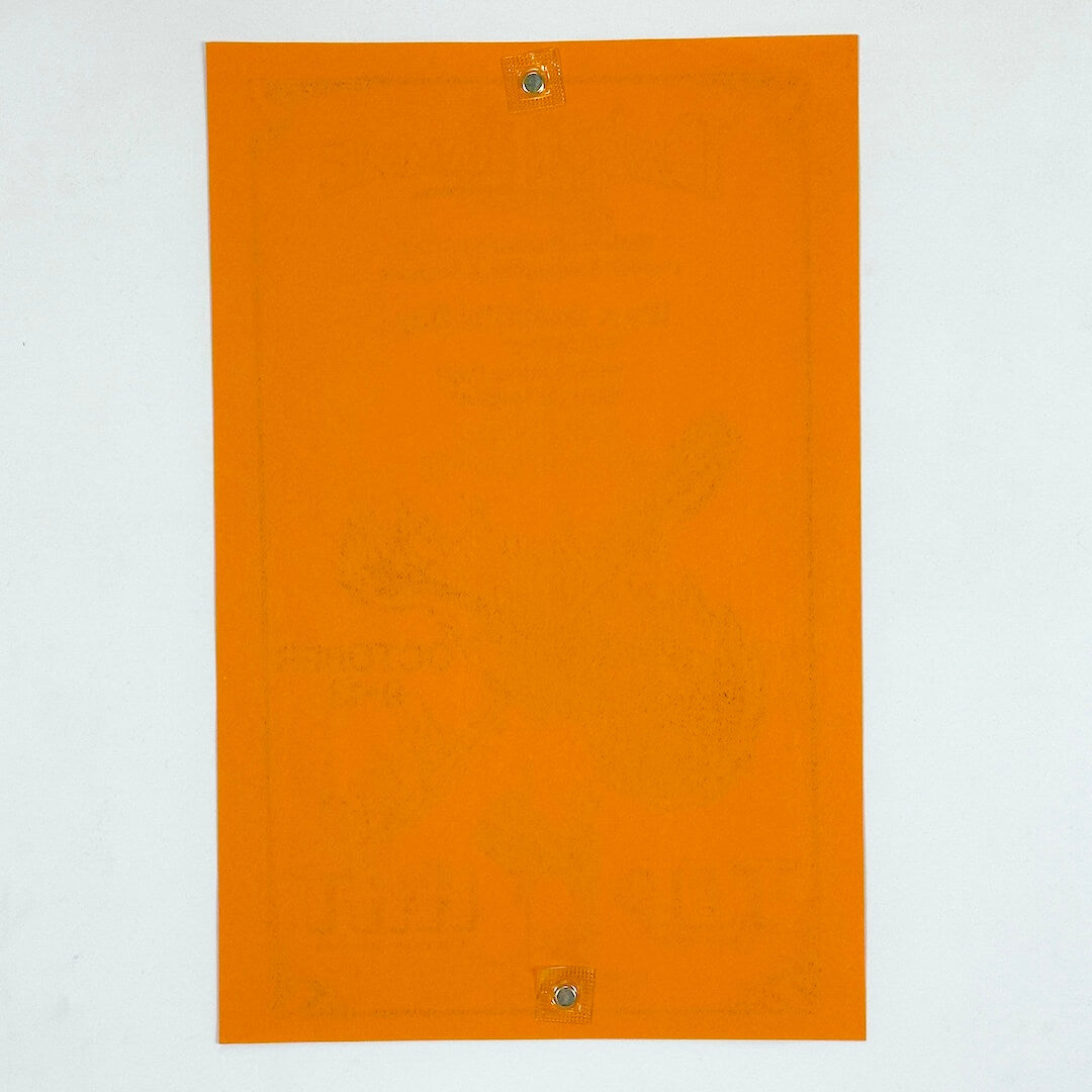 Backside of orange poster against white background. 