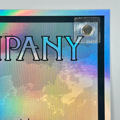 Top right corner of poster showing no damage to corner or edges, rainbow foil aspect of poster visible. 