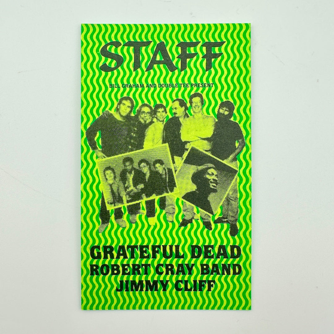 A green card with black-and-white group photo of the members and text reading 'Grateful Dead Robert Cray Band Jimmy Cliff'.
