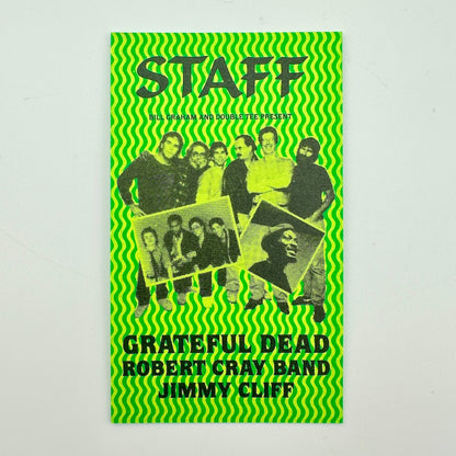 A green card with black-and-white group photo of the members and text reading 'Grateful Dead Robert Cray Band Jimmy Cliff'.