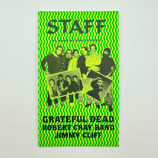 A green card with black-and-white group photo of the members and text reading 'Grateful Dead Robert Cray Band Jimmy Cliff'.