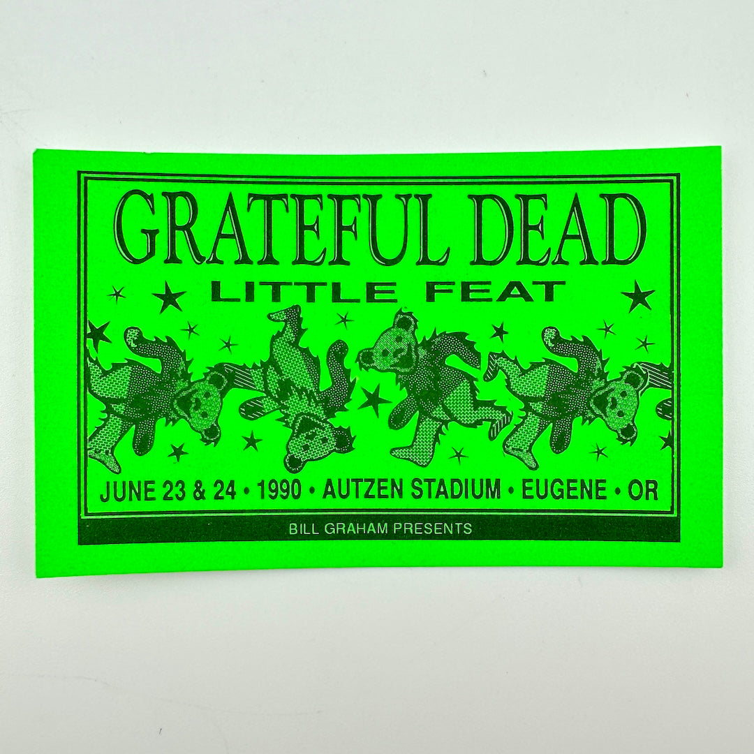 A Grateful Dead Little Feat concert laminate in neon green with black text and illustrations of dancing bears.