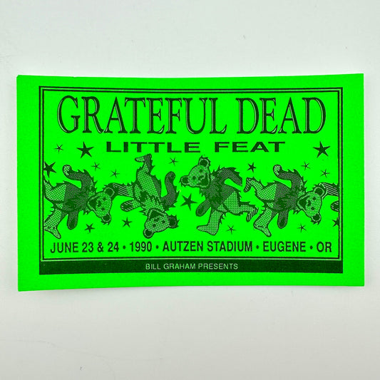 A Grateful Dead Little Feat concert laminate in neon green with black text and illustrations of dancing bears.