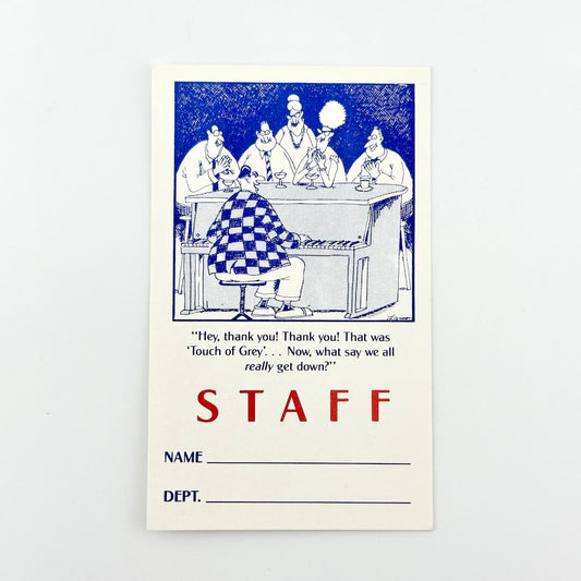 Back of backstage pass designating it as a staff pass beneath comic. 