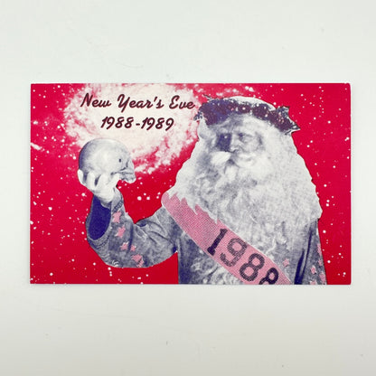 Pink laminate with "New Year's Eve, 1988-1989" with image of Father Time in black and white. 