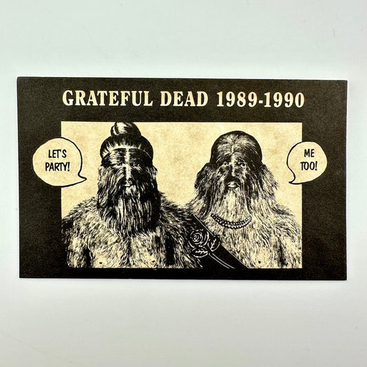 A rectangular printed card with 'GRATEFUL DEAD 1989-1990' above an illustrated portrait of two furry humanoid figures with speech bubbles. 