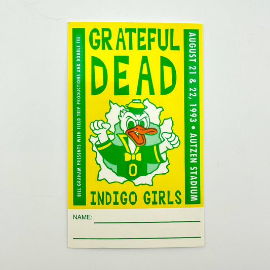 Yellow laminate with green text and image of duck in center. 