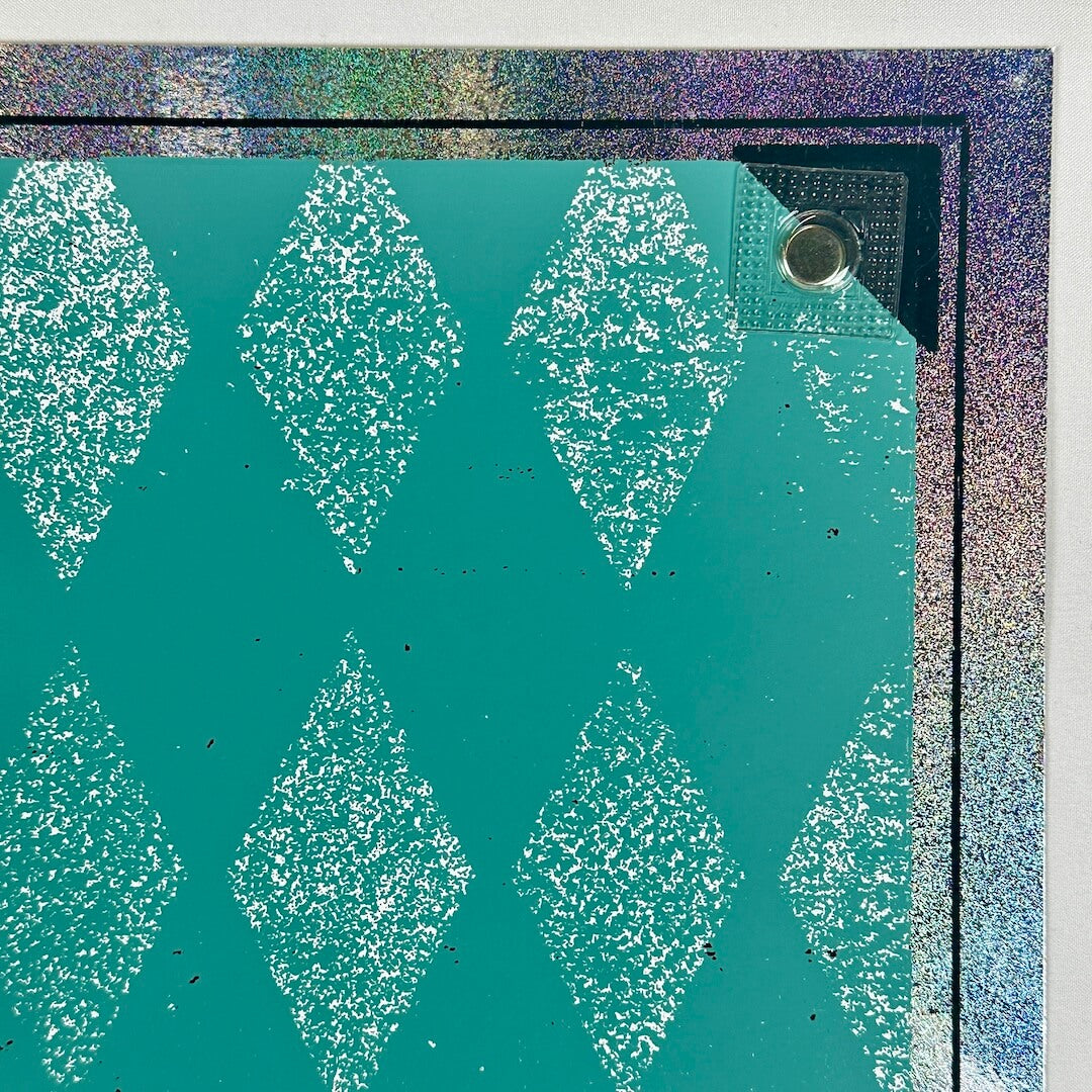 Top right corner showing tiny pin hole at corner of border that's nearly undetectable. 