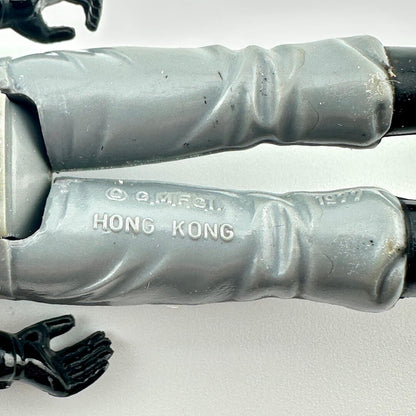 Close-up of back of figure's legs to show copyright and COO information. 