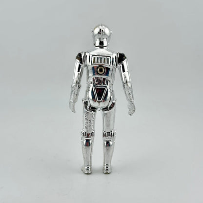 Silver robot toy figure on a gray background