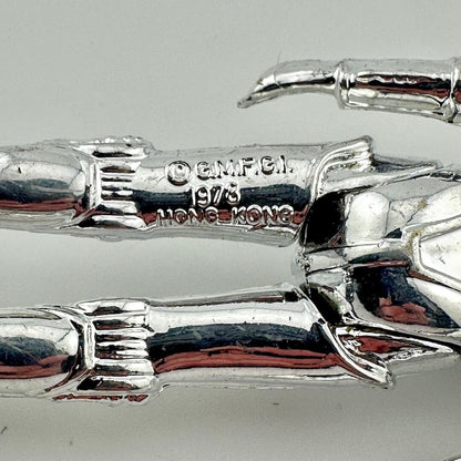 Close-up of back of figure's legs to show copyright and COO information. 