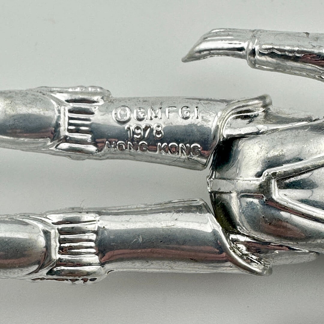Close-up of back of figure's legs to show COO and copyright information. 