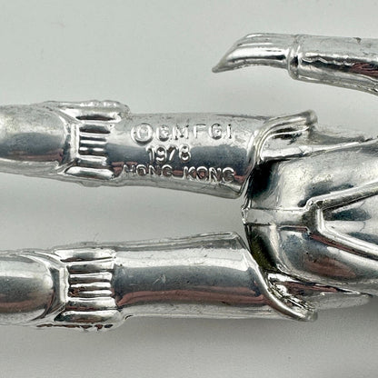 Close-up of back of figure's legs to show COO and copyright information. 