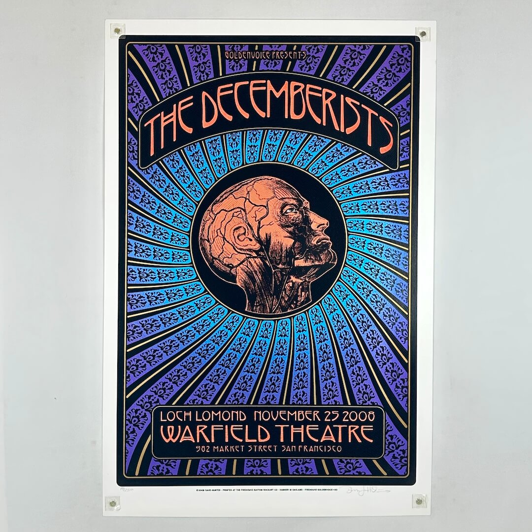 Multicolor poster for The Decemberists with human head in center with circulatory system visible. 
