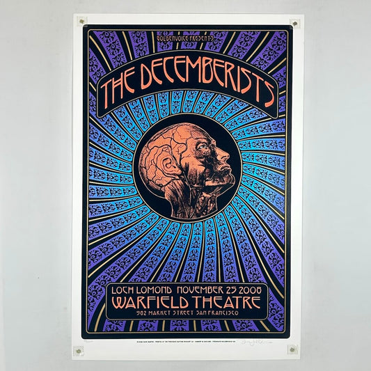 Multicolor poster for The Decemberists with human head in center with circulatory system visible. 