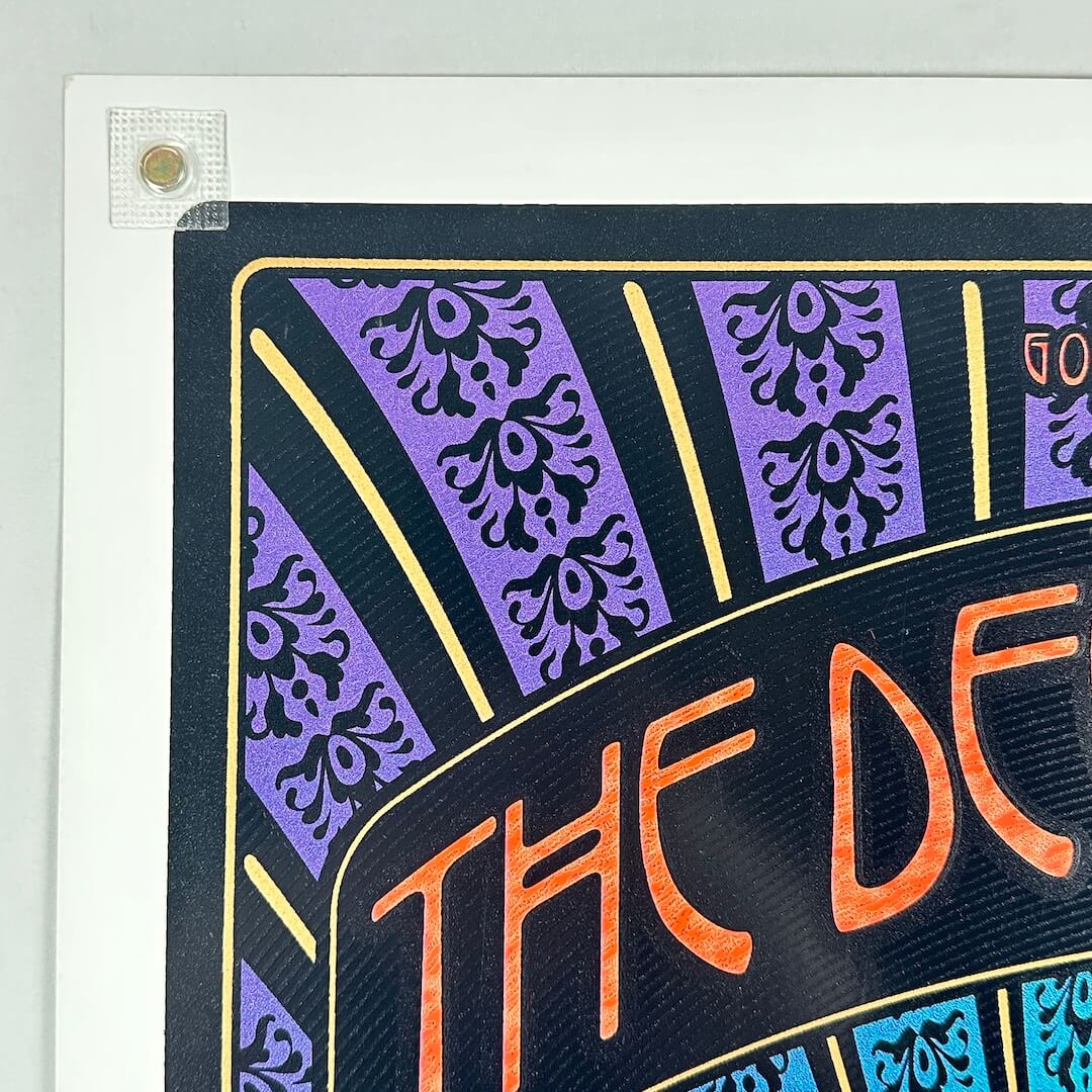 Top left corner of poster with no visible damage. 