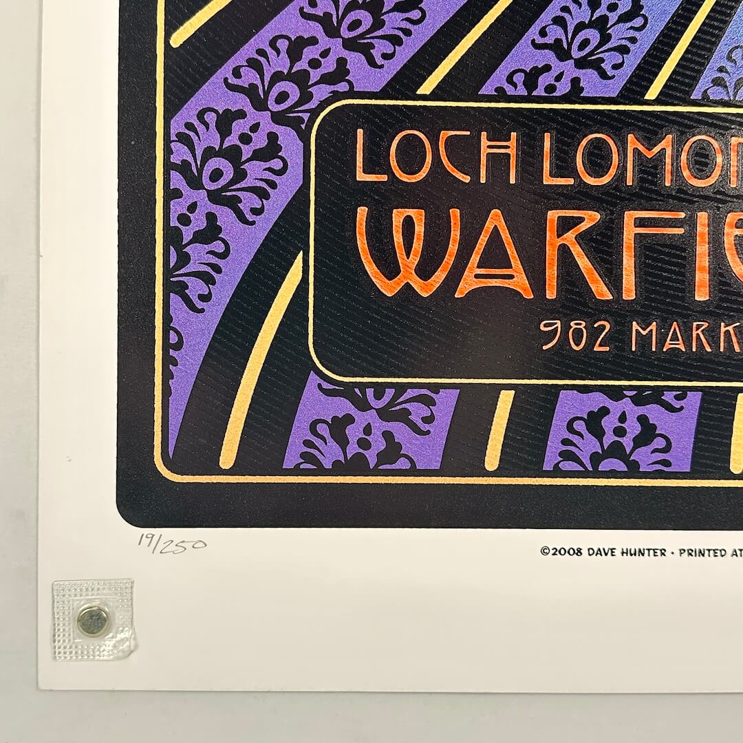 Bottom left corner of poster with no visible damage and poster number in pencil. 