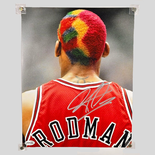 Person wearing a red sports jersey with a colorful hairstyle, signed on the back.
