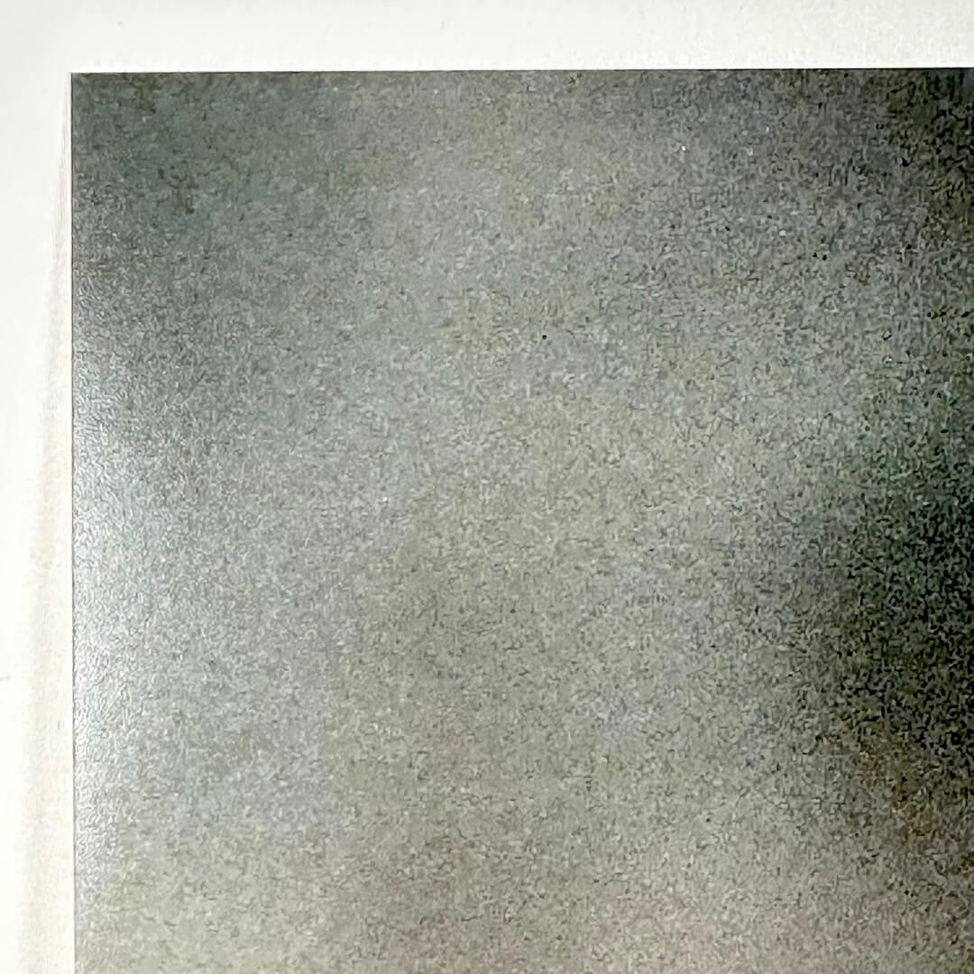 Top left corner of photo with no visible damage. 