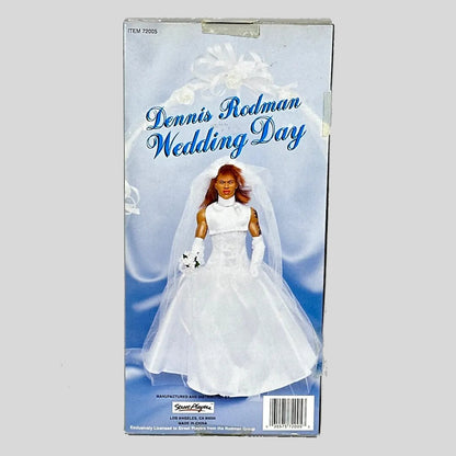Boxed action figure of a person in a wedding dress with 'Dennis Rodman Wedding Day' text.
