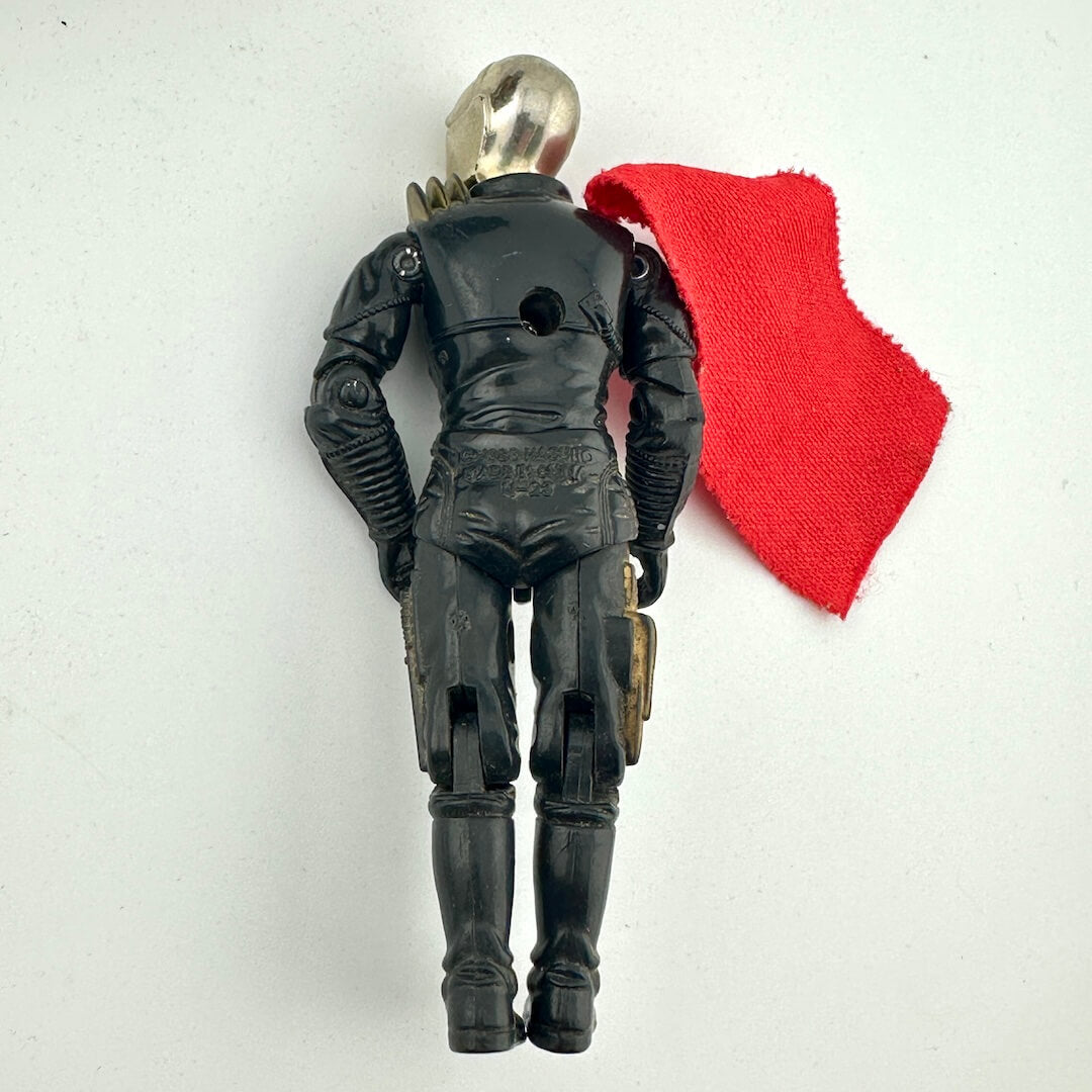 Black action figure with a red cape on a white background