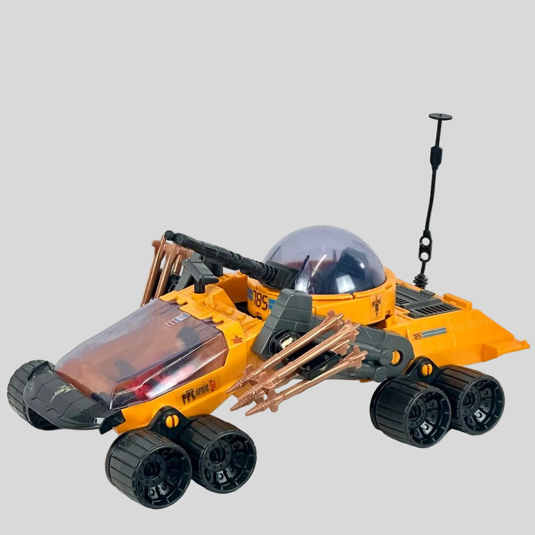 Toy vehicle with a transparent dome and mechanical arms on a white background