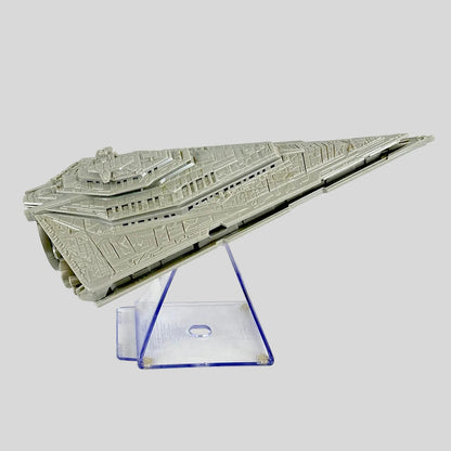 A gray plastic model of a Star Wars Star Destroyer displayed on a clear acrylic stand against a white background.