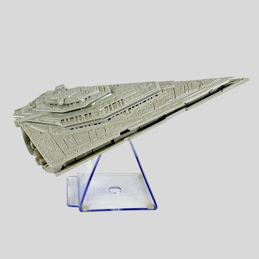 A gray plastic model of a Star Wars Star Destroyer displayed on a clear acrylic stand against a white background.