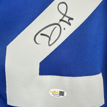 Blue and white sports jersey with a signature and JSA authentication label.